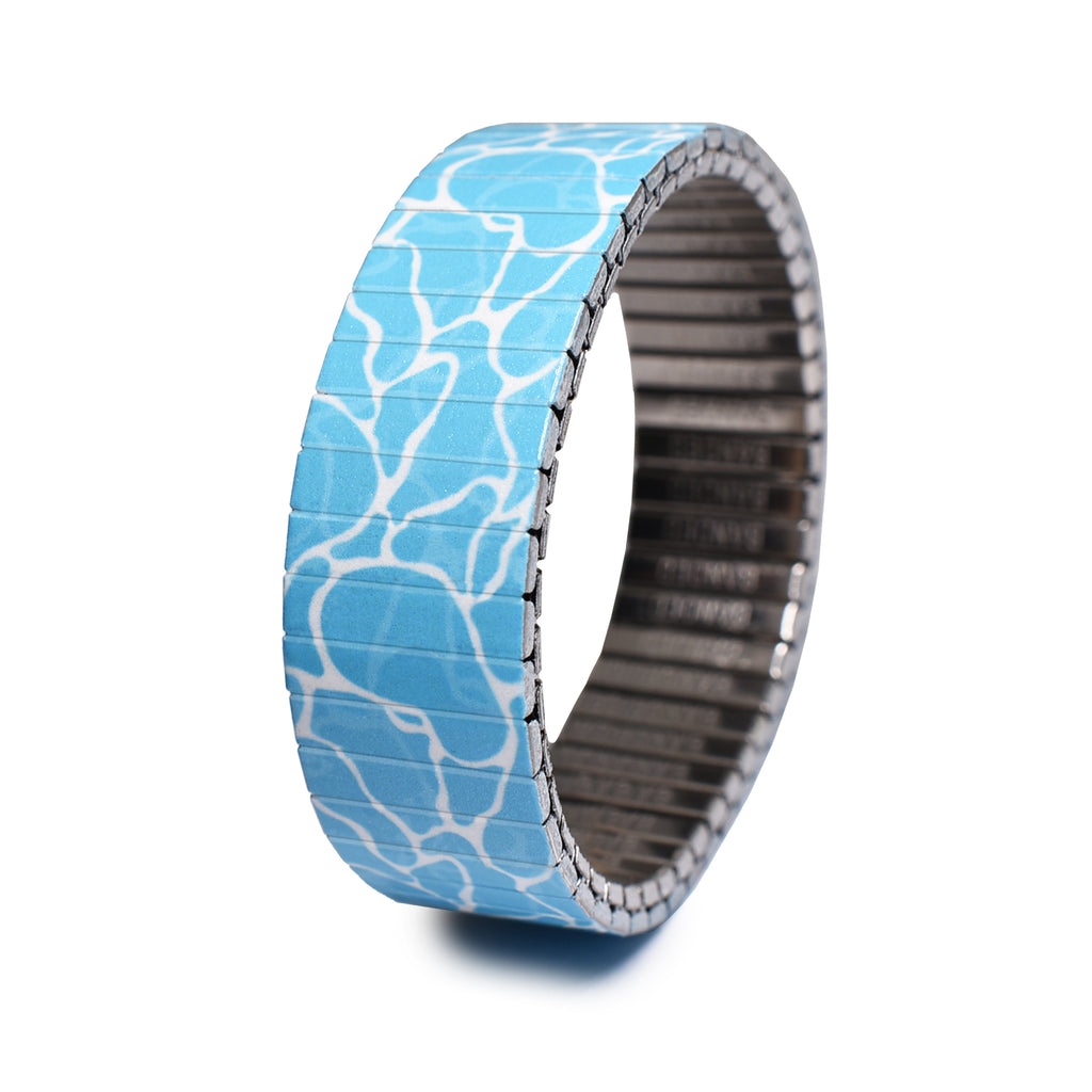 Waves - Swimming Pool - 18mm - Classic Finish  A timeless reminder of the beauty of the ocean. Our "Way of the Wave" collection brings fresh air to all of our landlocked Banded fans out there, to those who surf with body, soul and mind. Waterproof & wave friendly. With this collection we bring the expansive blue to the very thing that makes sunsets perfect... because a sunset isn't as memorable when you're not wearing a wave around your wrist.
