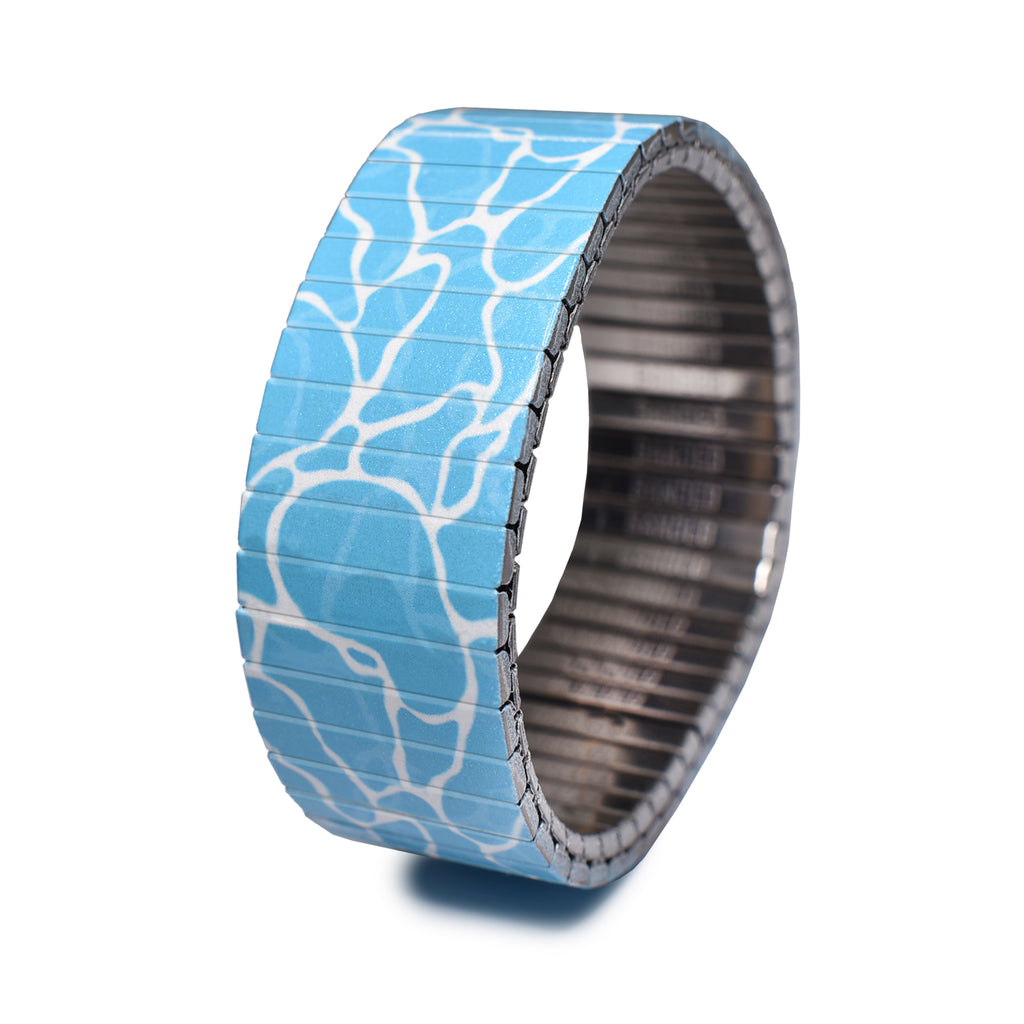 Waves - Swimming Pool - 23mm - Classic Finish  A timeless reminder of the beauty of the ocean. Our "Way of the Wave" collection brings fresh air to all of our landlocked Banded fans out there, to those who surf with body, soul and mind. Waterproof & wave friendly. With this collection we bring the expansive blue to the very thing that makes sunsets perfect... because a sunset isn't as memorable when you're not wearing a wave around your wrist.