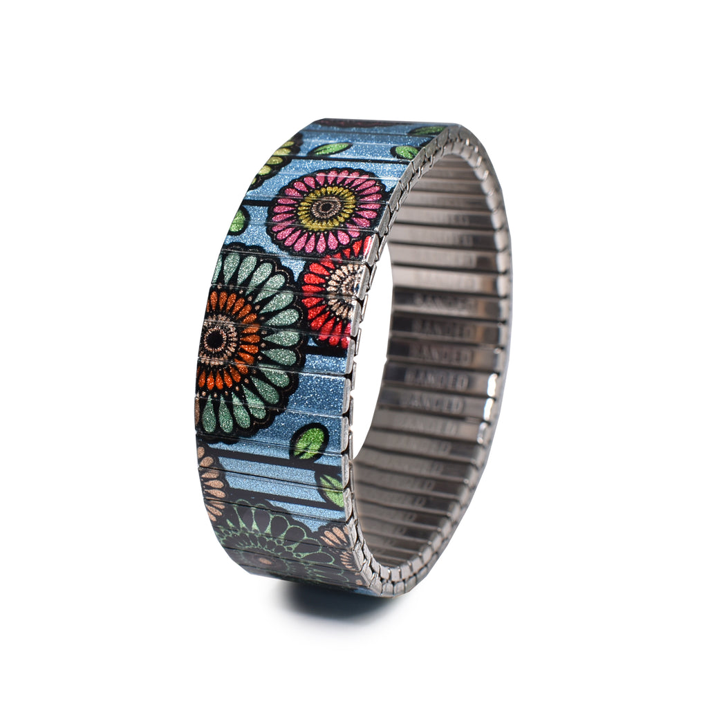 Flora Atomica - Le Train Bleu - 18mm - Metallic Finish  Ein Strauß in den Farben von Paris mit einem funkelnden himmelblauen Hintergrund. Eine Hommage an die Dekadenz eines unserer beliebtesten Gourmet-Stopps im Gare de Lyon.