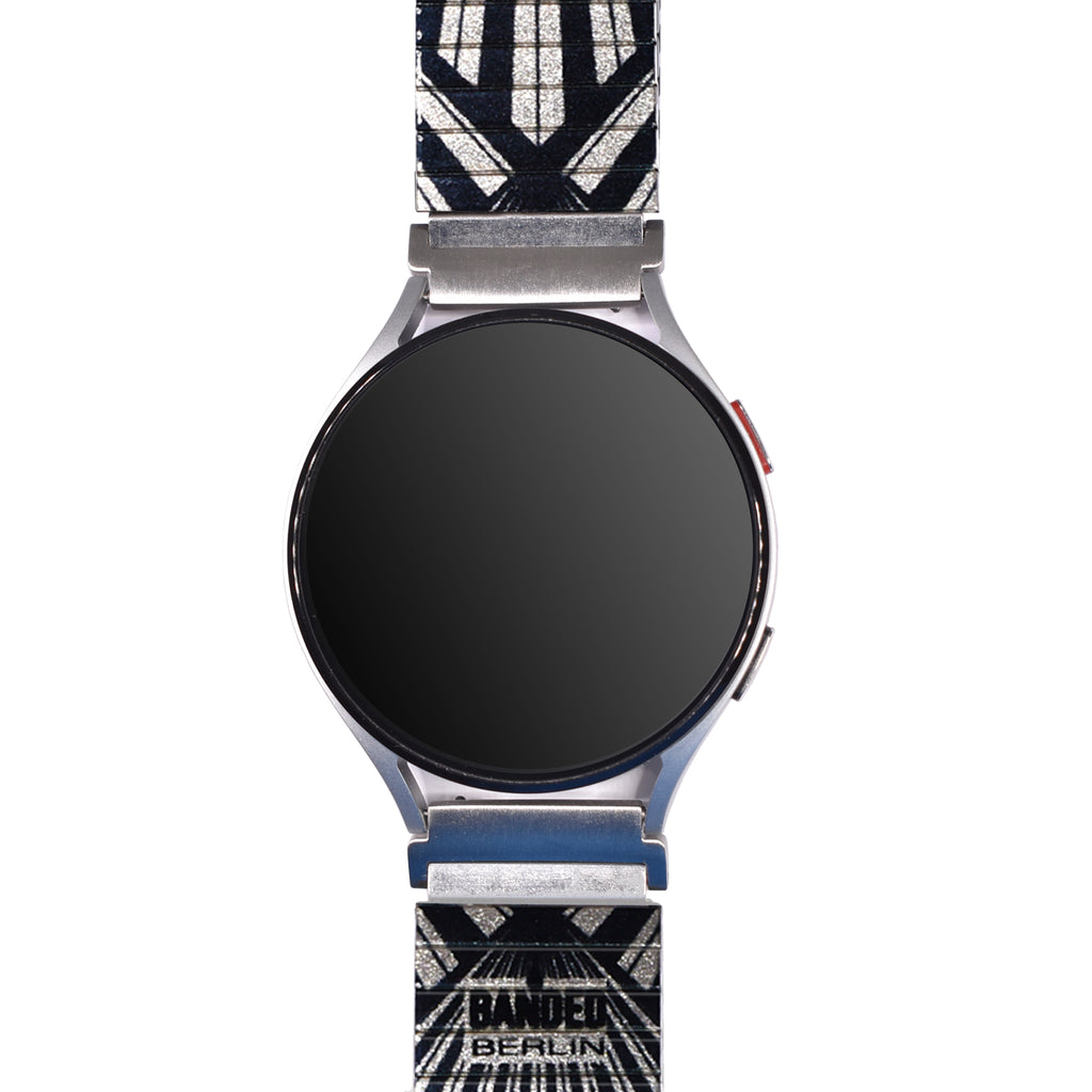 Metropolis - Calagari Sunrise - Banded for Smart Watch Metallic Finish  Berlin ist das Hollywood der 20er Jahre. Hier erfinden die Regisseure der Weimarer Republik die Zukunft des Films. Pure Magie gebannt auf silbrig-glänzendem Celluloid.