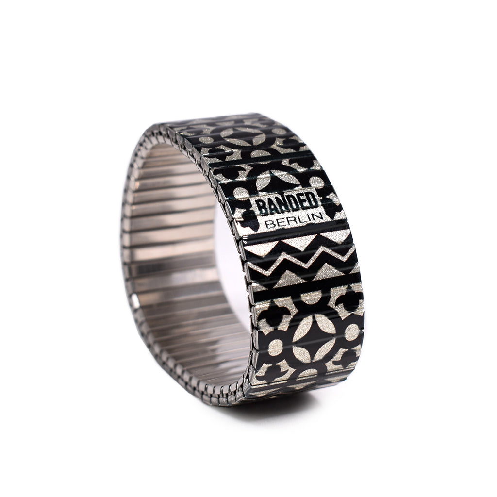 From the Banded Berlin Fertile Crescent collection, This Black and cream Arabic tile inspired design conjures up fond memories of our nights in Marrakesh and beyond. Made from the iconic stainless steel expandable watch band. Scratch resistant and watch proof. Made in Berlin, Germany by Banded Berlin Bracelets