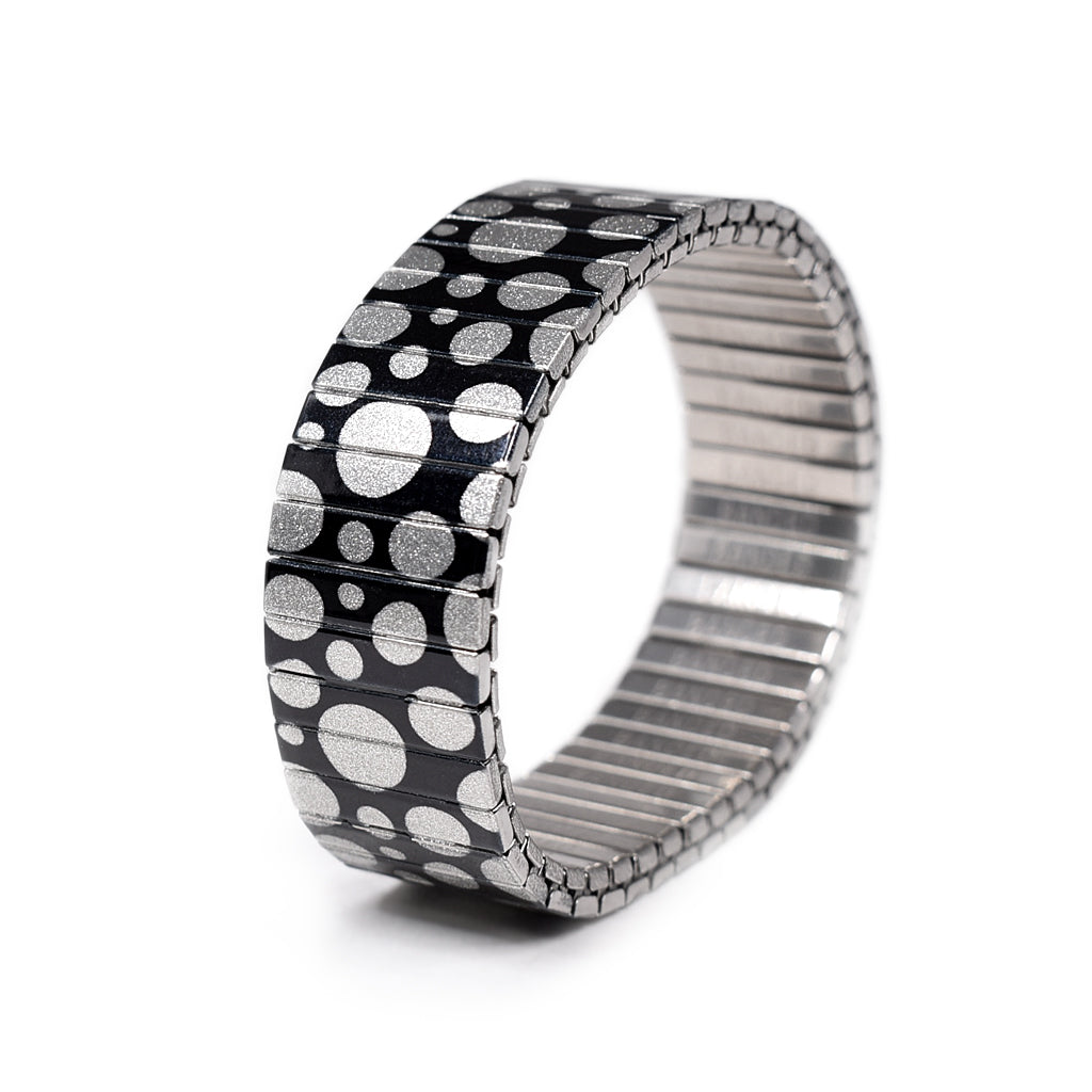 More Bubbles, Honey - A metallic version 2020 An OG, “More Bubbles, Honey” is one of our earliest patterns and a sentimental favorite. Illuminated moon bubbles floating in outer space. A playful style for those of us who feel like squares and need the night lighted.