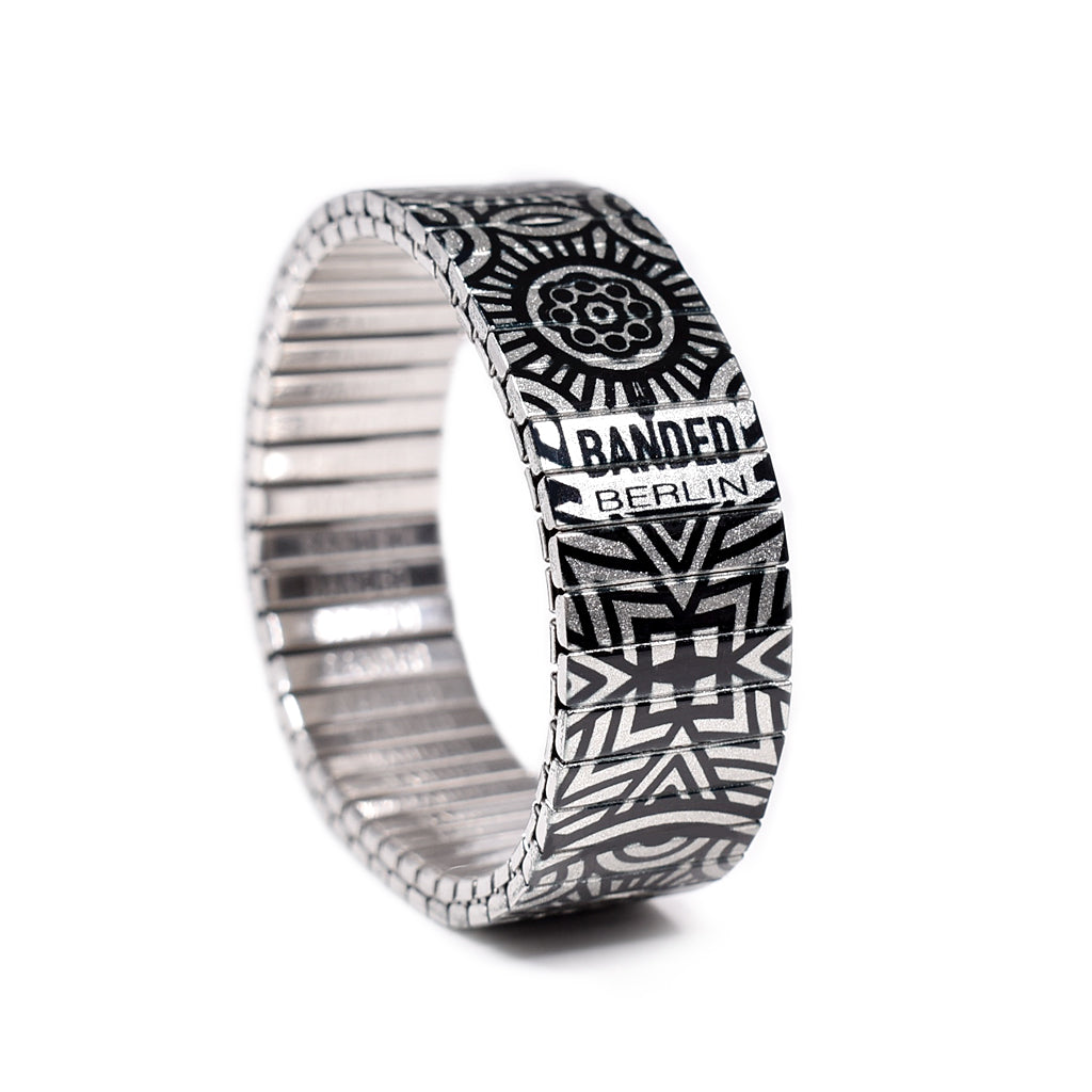 Gaudi's Footsteps - El Capitan Metallic The Pyrenees as seen from above with its borders of black and white that divide the imagination. A style for the explorers of mountainous or emotive ranges. New for Summer 2020 By Banded Berlin Bracelets . Made in Berlin