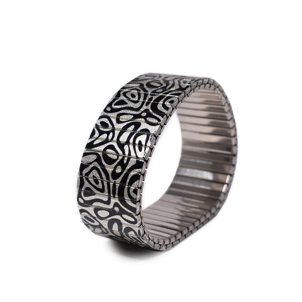 Oil Noir in Metallic. Sheer gorgeousness in an 23mm width. This stainless steel beauty has been a stalwart in our collection for a fortnight or two.. now available in metallic. by Banded Berlin  Edit alt text