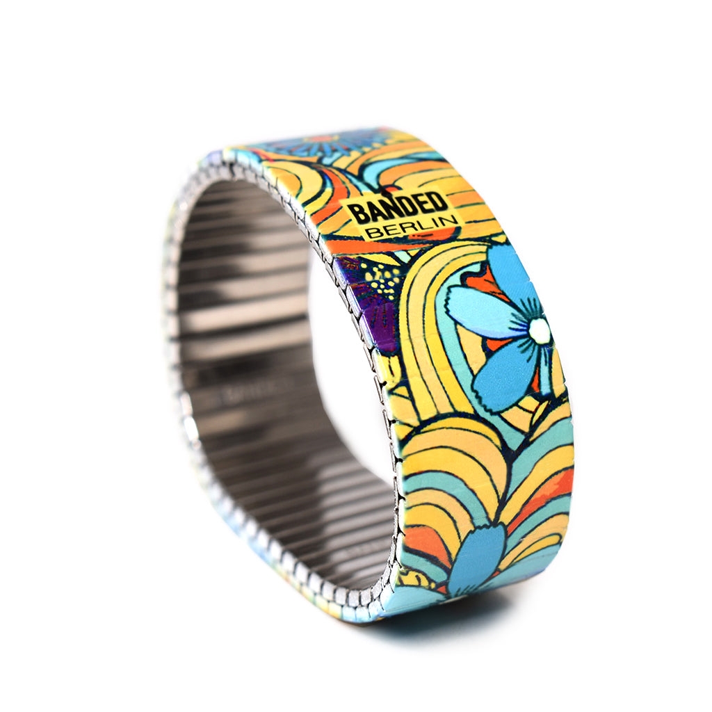 Squiggle-Flower- Pop- Tropicali 23mm A Yellow hued version of our best selling “Squiggle Flower Pop” style. New for Summer 2020. Rostfreier Stahl, nickelfrei, kratz- und wasserfest. by Banded Berlin Bracelets